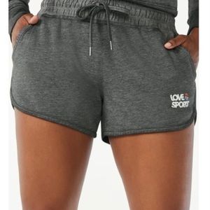 Love And Sports Women’s Mid Rise High Performance Logo Shorts.NWT